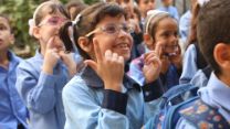 Alma ( aged 10) learning sign language at ASDC.
