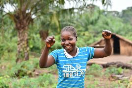 A woman raising her hands in victory