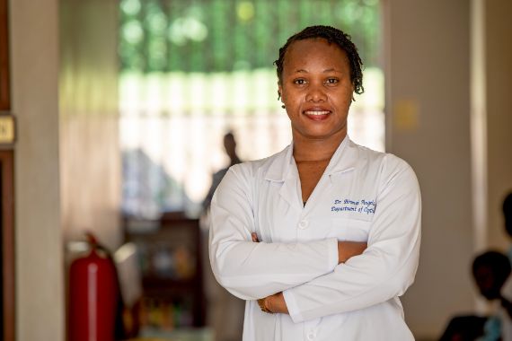 A woman in a doctor's lab coat