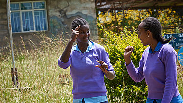 Two students of EECMY School for the Deaf chat in sign language in Ethiopia. 2018 ©CBM