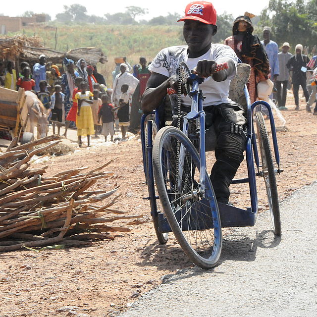 Amadou (22) with his tricycle in his village in south west Niger. 