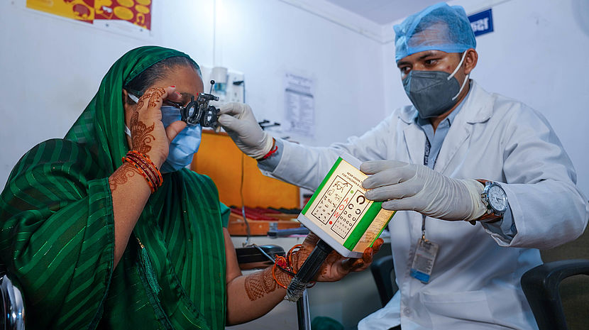 A woman, Mrs Sukhmani having her eyes tested by Hari Prasad at the Sirali Vision Centre, Madhya Pradesh, India
